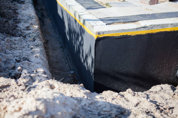 Professional Basement Waterproofing technician working in Clinton, WA